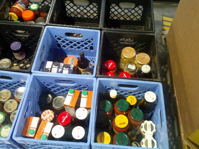 Crates filled with glass jars.
